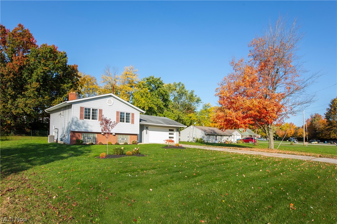 9030 Reed Road North Ridgeville, OH 44039 - Photo 2 of 35 View of front facade with a front yard