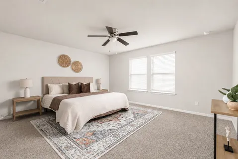 a bedroom with bed and a window