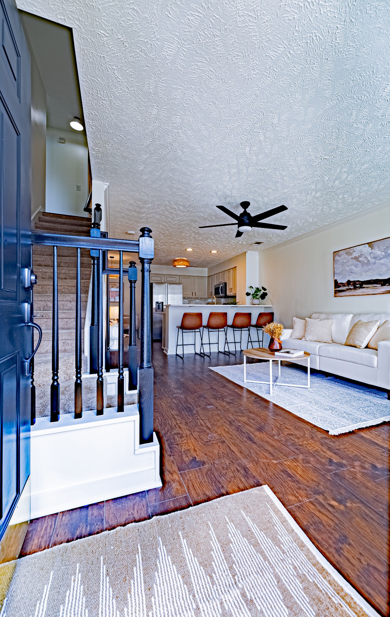 423 Compton Lane Franklin, TN 37069 - Photo 3 of 23 a living room with lots of furniture and gym equipment
