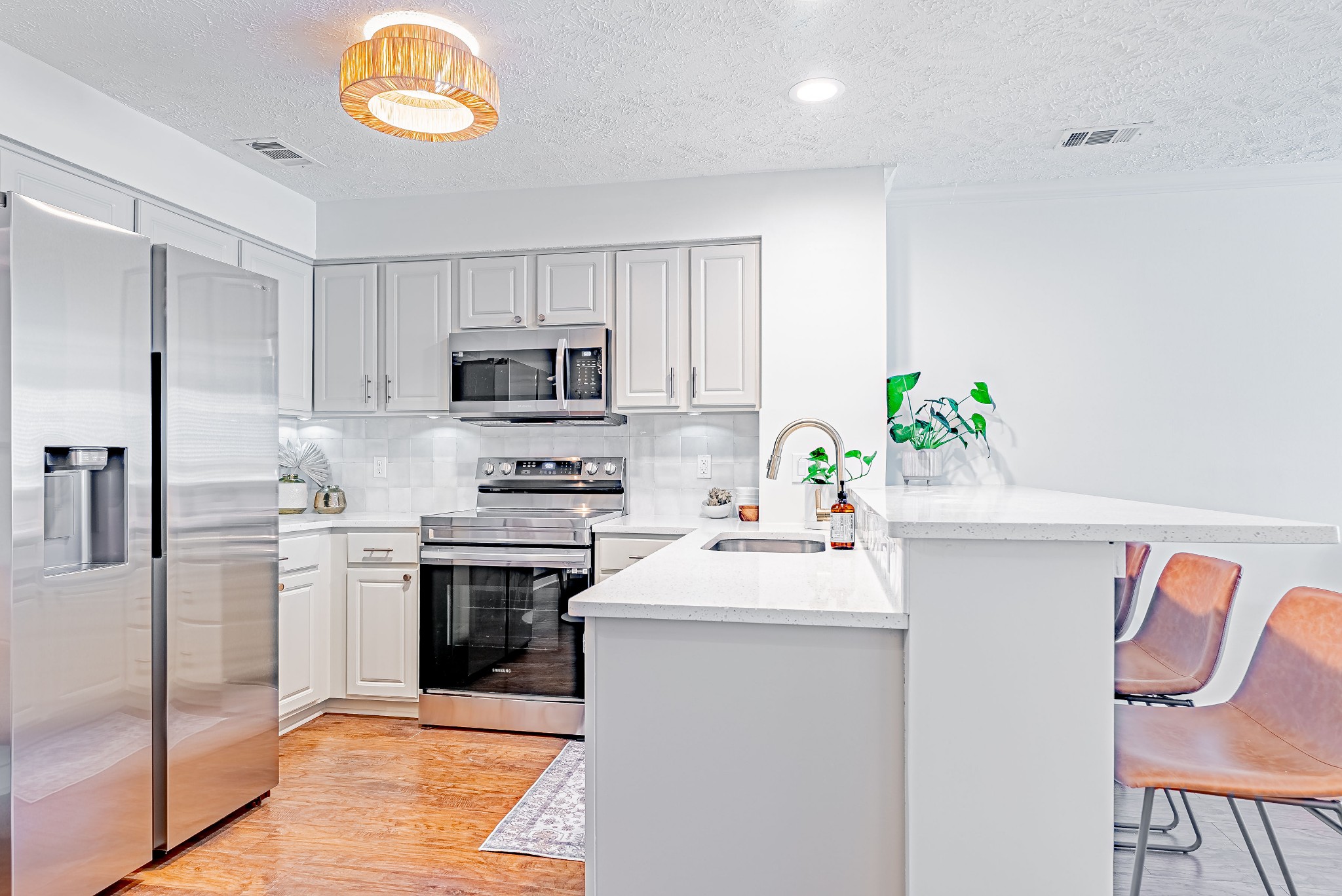 423 Compton Lane Franklin, TN 37069 - Photo 7 of 23 a kitchen with granite countertop a sink appliances and cabinets