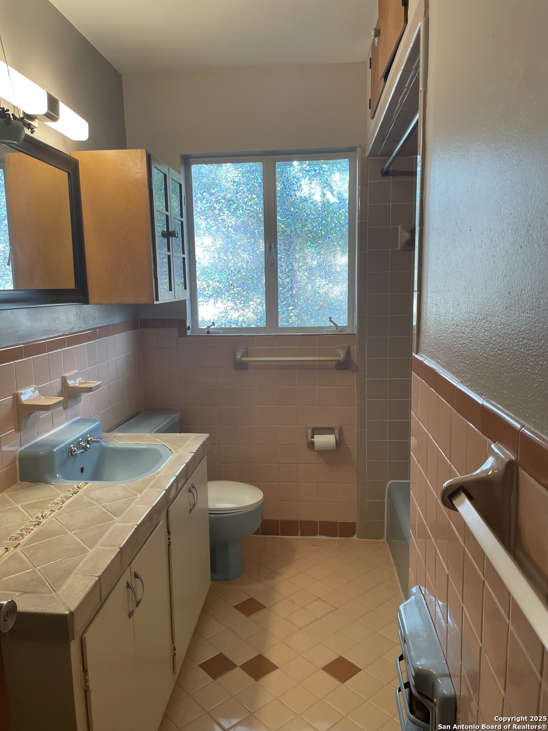 411 Future Drive San Antonio, TX 78213 - Photo 21 of 21 a bathroom with a granite countertop sink a mirror and a toilet