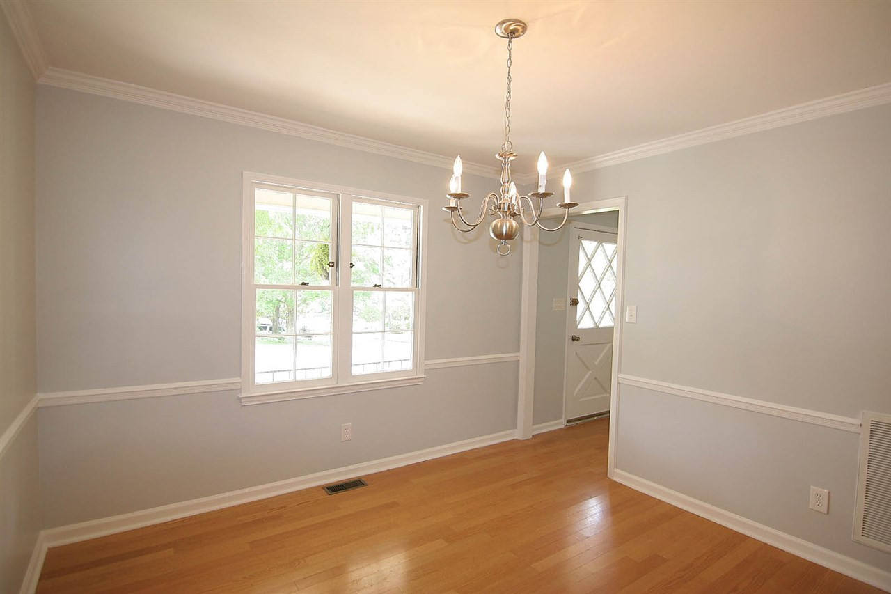 7801 Audubon Drive Raleigh, NC 27615 - Photo 6 of 25 Dining Room has Stunning Crown Molding & Chairrail -- Dining Space is a Joy to Entertain your Finest Friends and Family -- Super, Easy Flow for Entertaining Dining Room
