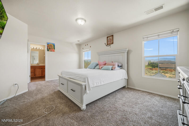7873 Welsh Drive Reno, NV 89506 - Photo 11 of 34 a bed room with a bed and a window