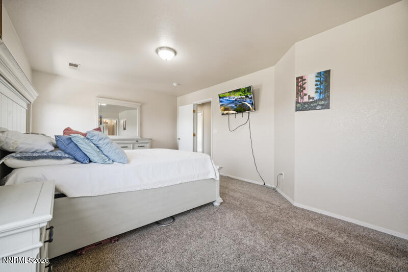 7873 Welsh Drive Reno, NV 89506 - Photo 13 of 34 a bed room with a bed and a painting