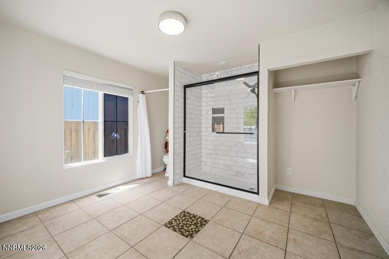 7873 Welsh Drive Reno, NV 89506 - Photo 16 of 34 an empty room with windows and entrance