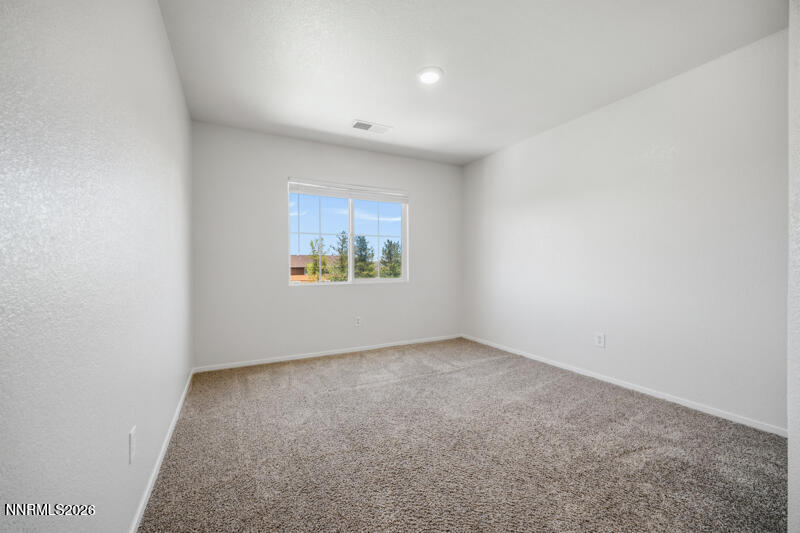 7873 Welsh Drive Reno, NV 89506 - Photo 19 of 34 an empty room with windows