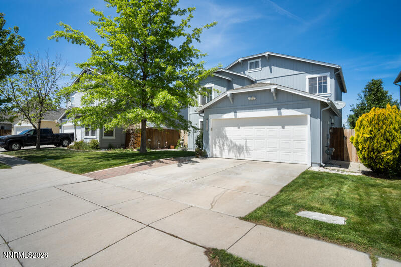 7873 Welsh Drive Reno, NV 89506 - Photo 2 of 34 a front view of a house with a yard