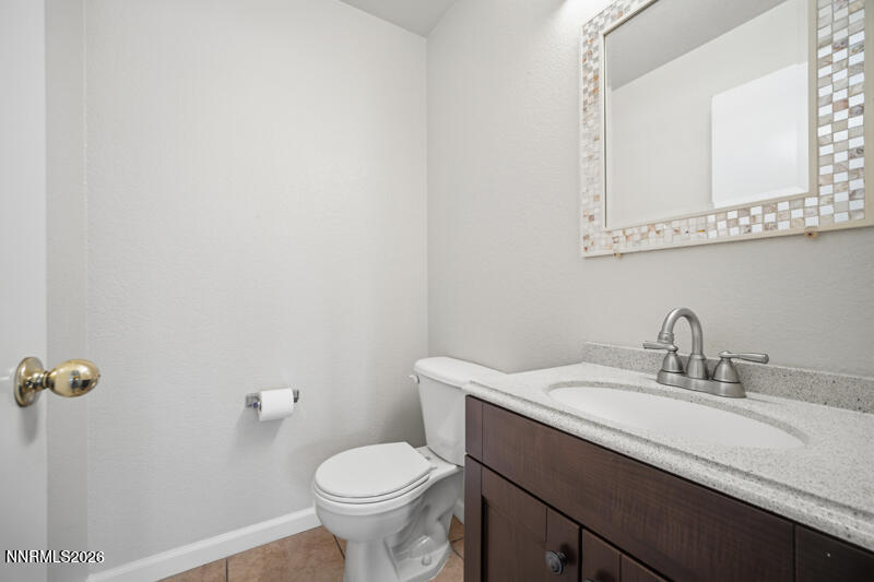 7873 Welsh Drive Reno, NV 89506 - Photo 26 of 34 a bathroom with a sink and a toilet