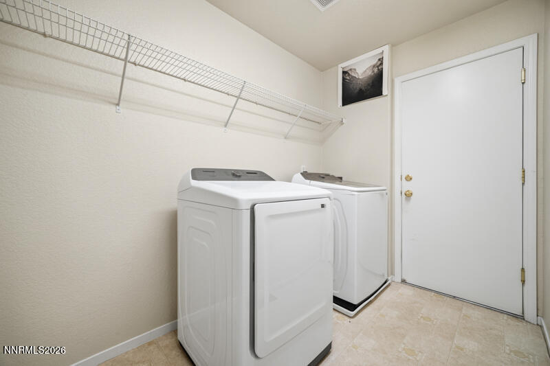 7873 Welsh Drive Reno, NV 89506 - Photo 27 of 34 a utility room with dryer and washer