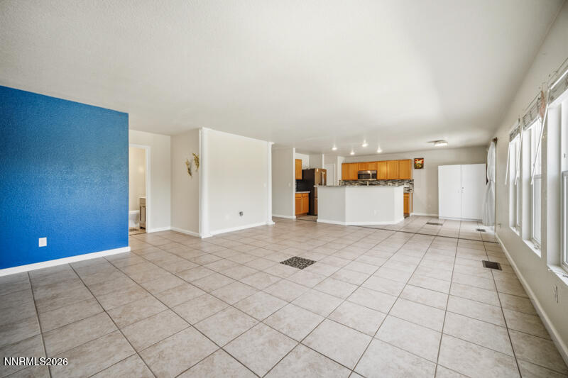 7873 Welsh Drive Reno, NV 89506 - Photo 4 of 34 a view of a livingroom with a barbeque and entryway