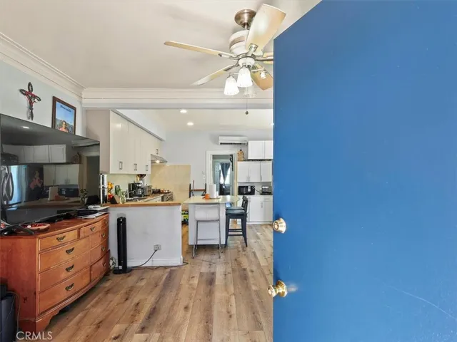 a kitchen with cabinets a sink and appliances