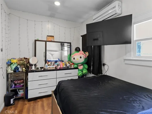 a bed room with a bed window and a couch