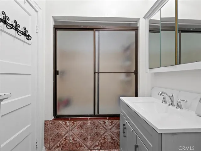 a bathroom with a sink and mirror
