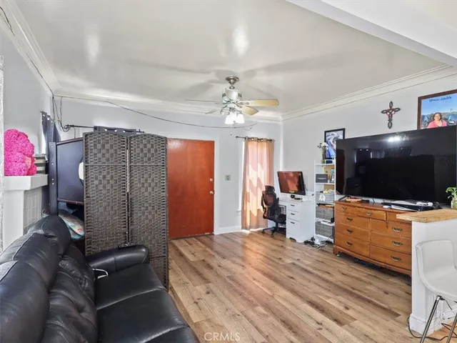 a bedroom with furniture and a flat screen tv