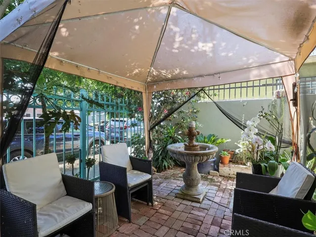a view of a patio with couches table and chairs