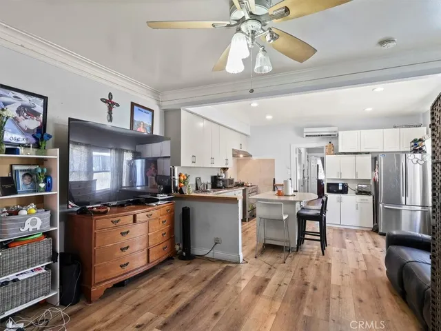 a kitchen with cabinets a sink and appliances