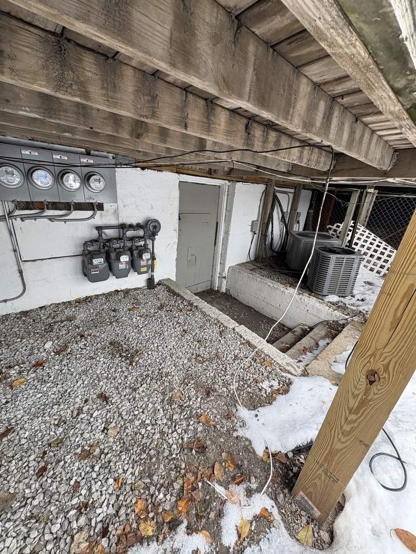 8729 South Commercial Avenue Chicago, IL 60617 - Photo 14 of 17 a view of a room with racks on the wall