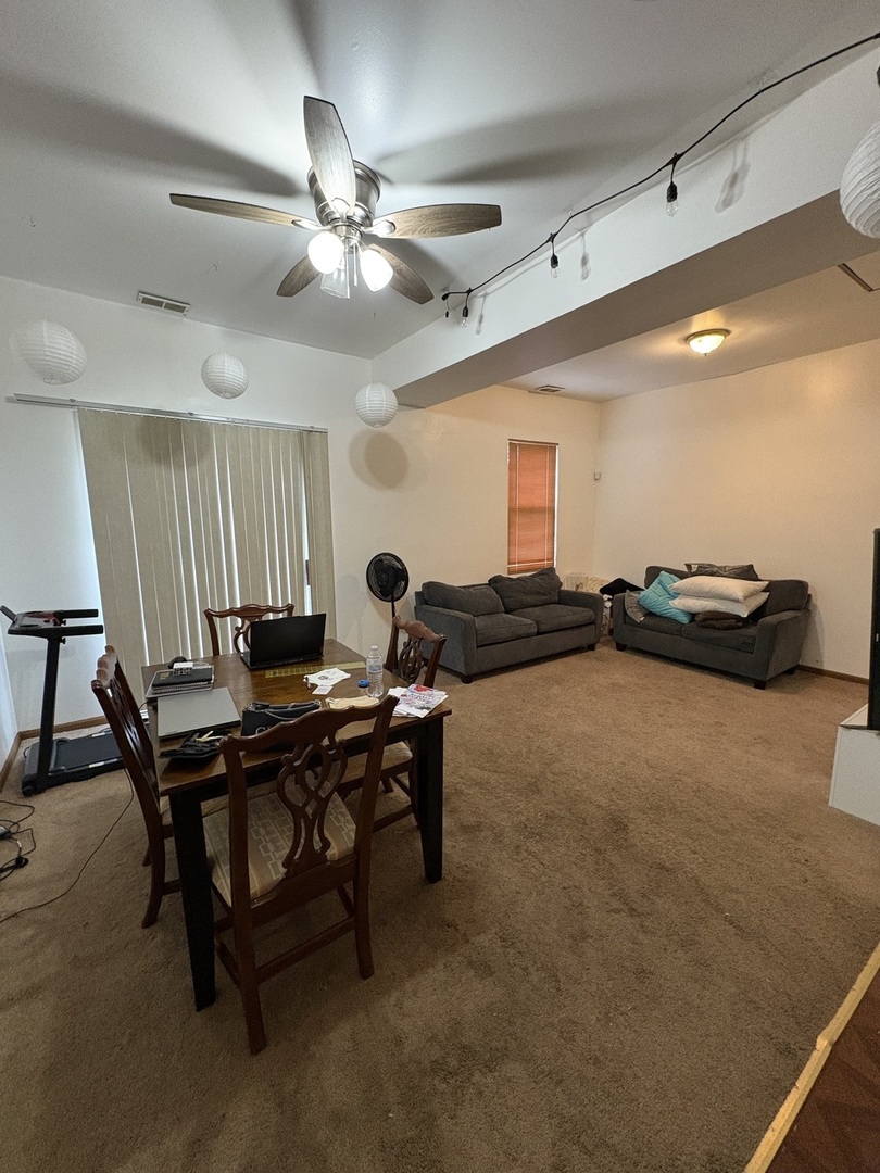 8729 South Commercial Avenue Chicago, IL 60617 - Photo 3 of 17 a view of a workspace with furniture