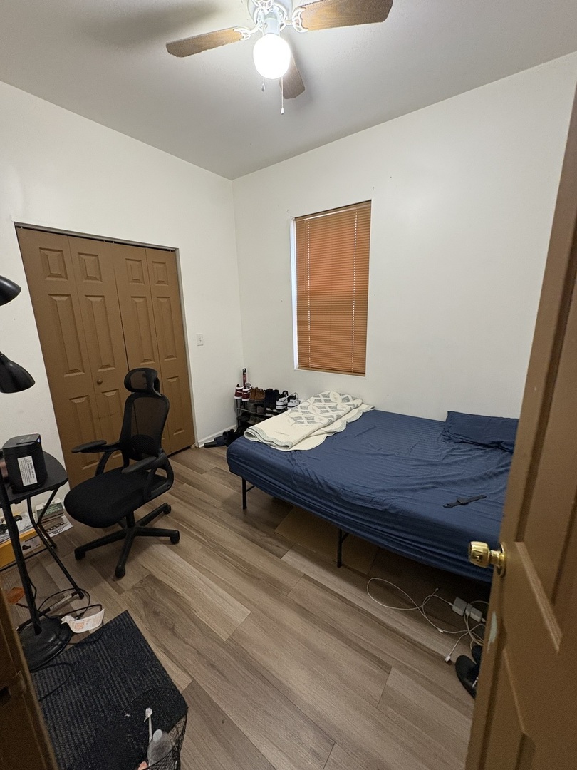 8729 South Commercial Avenue Chicago, IL 60617 - Photo 7 of 17 a room with furniture and wooden floor