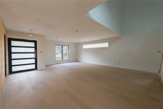 a view of empty room with a fireplace
