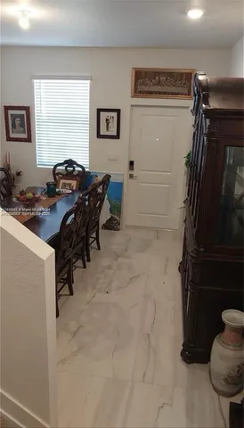 a view of a workspace with furniture