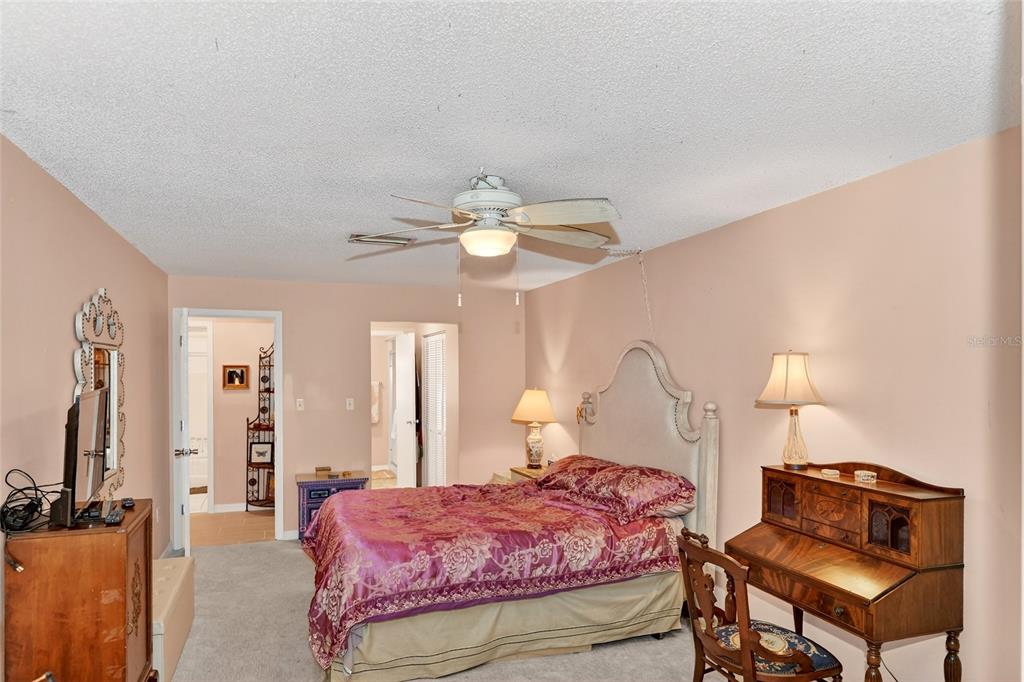 4160 Fruitville Road, Unit 11 Sarasota, FL 34232 - Photo 18 of 63 a bedroom with a bed and a tv on table