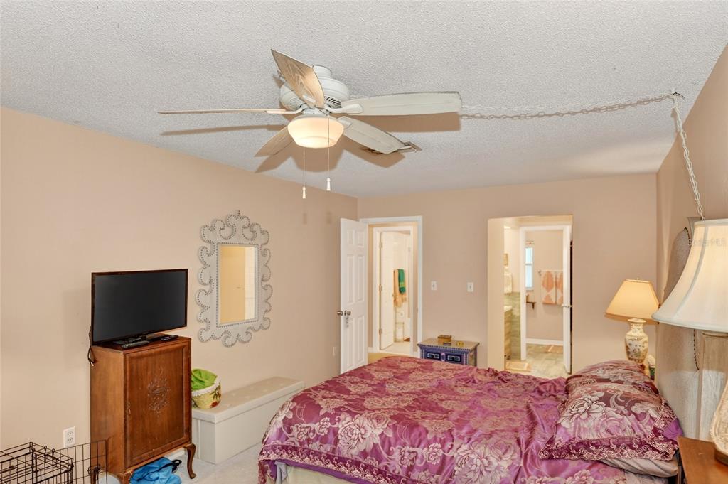 4160 Fruitville Road, Unit 11 Sarasota, FL 34232 - Photo 19 of 63 a bedroom with a bed and a flat screen tv