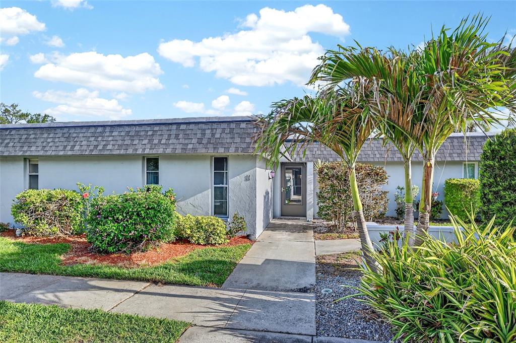 4160 Fruitville Road, Unit 11 Sarasota, FL 34232 - Photo 2 of 63 a front view of a house with garden