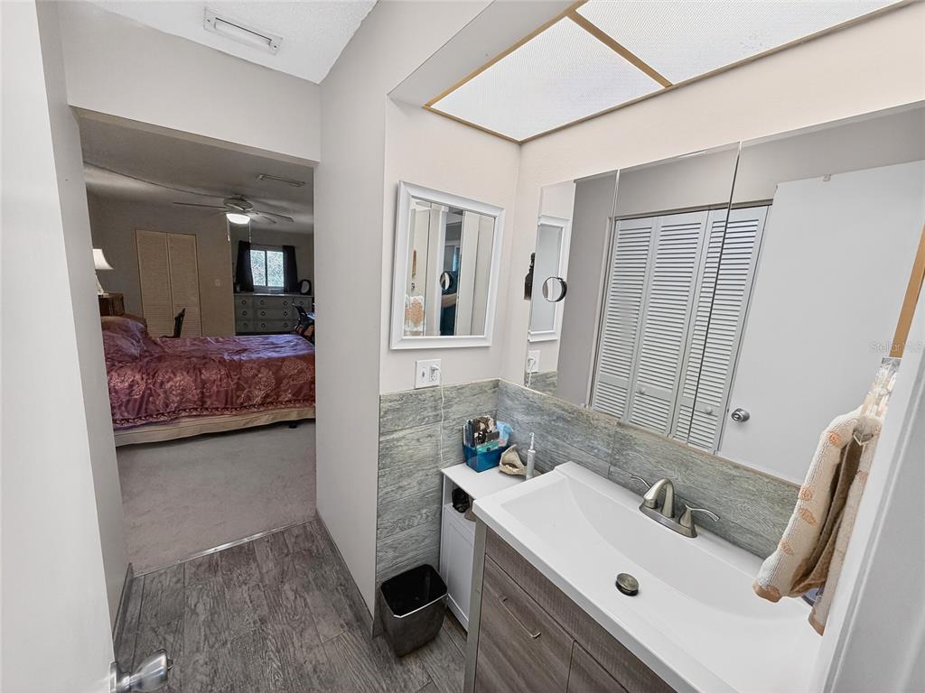 4160 Fruitville Road, Unit 11 Sarasota, FL 34232 - Photo 22 of 63 a en suite bathroom with a sink and a mirror