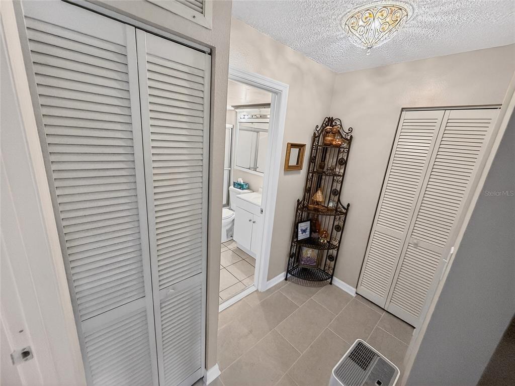 4160 Fruitville Road, Unit 11 Sarasota, FL 34232 - Photo 25 of 63 a view of walk in closet with clothes