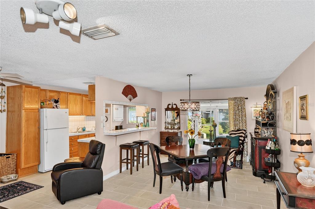 4160 Fruitville Road, Unit 11 Sarasota, FL 34232 - Photo 4 of 63 a dining room with furniture window and outside view