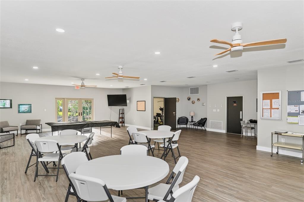 4160 Fruitville Road, Unit 11 Sarasota, FL 34232 - Photo 50 of 63 a living room with furniture kitchen view and a wooden floor