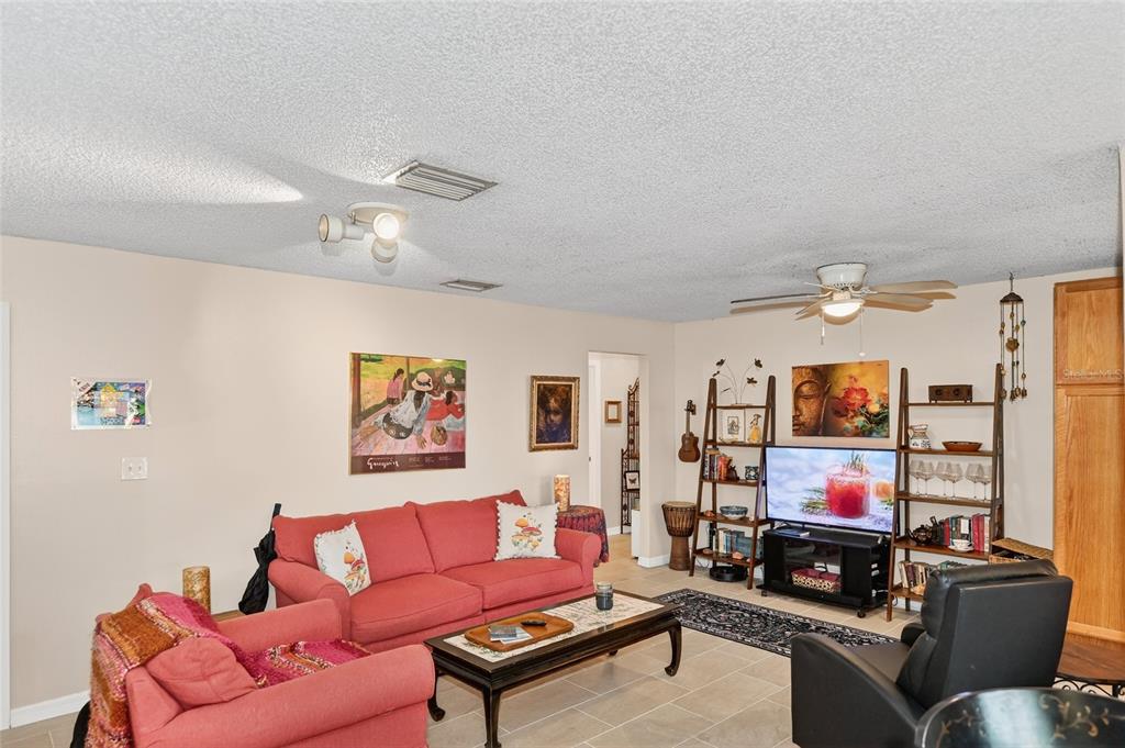 4160 Fruitville Road, Unit 11 Sarasota, FL 34232 - Photo 5 of 63 a living room with furniture and a flat screen tv