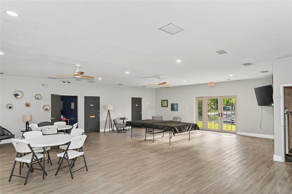 4160 Fruitville Road, Unit 11 Sarasota, FL 34232 - Photo 53 of 63 a living room with furniture and a wooden floor