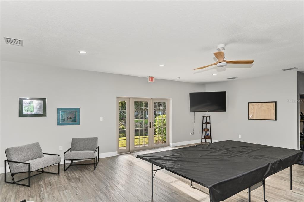 4160 Fruitville Road, Unit 11 Sarasota, FL 34232 - Photo 54 of 63 a living room with furniture and a flat screen tv