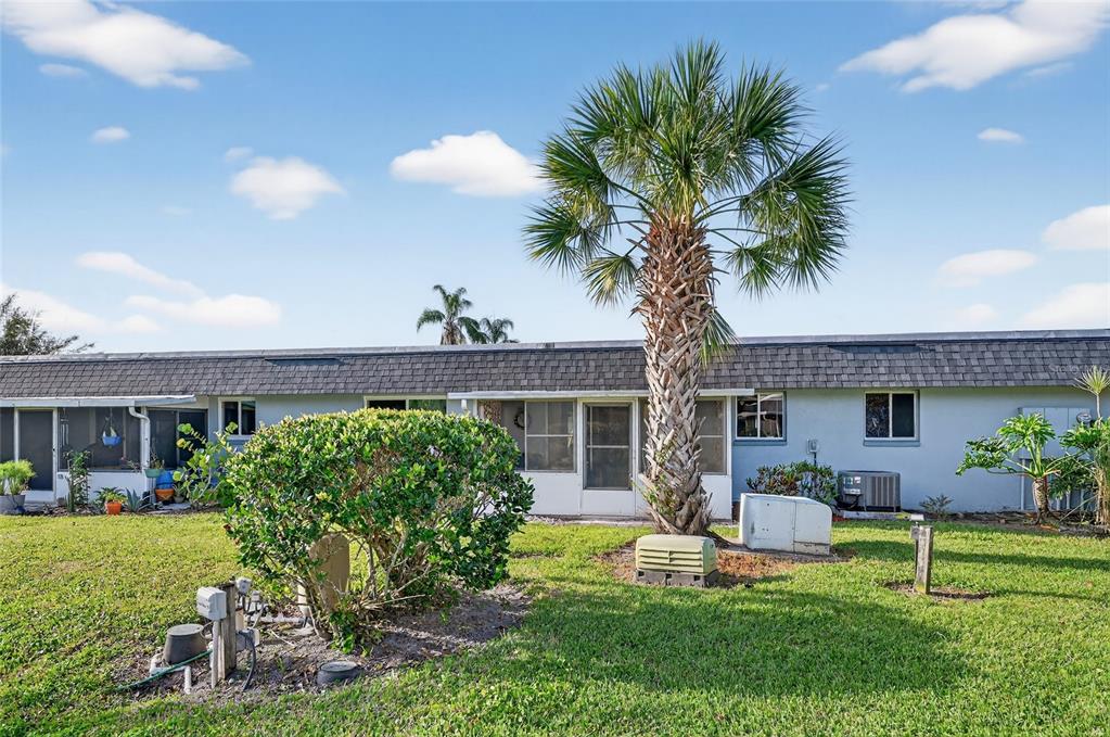 4160 Fruitville Road, Unit 11 Sarasota, FL 34232 - Photo 56 of 63 a front view of a house with a yard and a garden