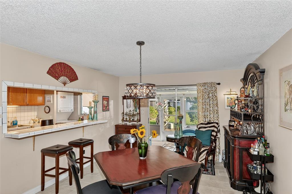 4160 Fruitville Road, Unit 11 Sarasota, FL 34232 - Photo 9 of 63 a dining room with furniture and window