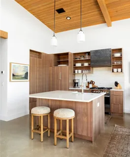 a kitchen with stainless steel appliances a stove a sink and a refrigerator