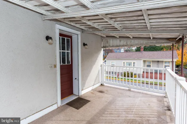 a view of a porch with a bench