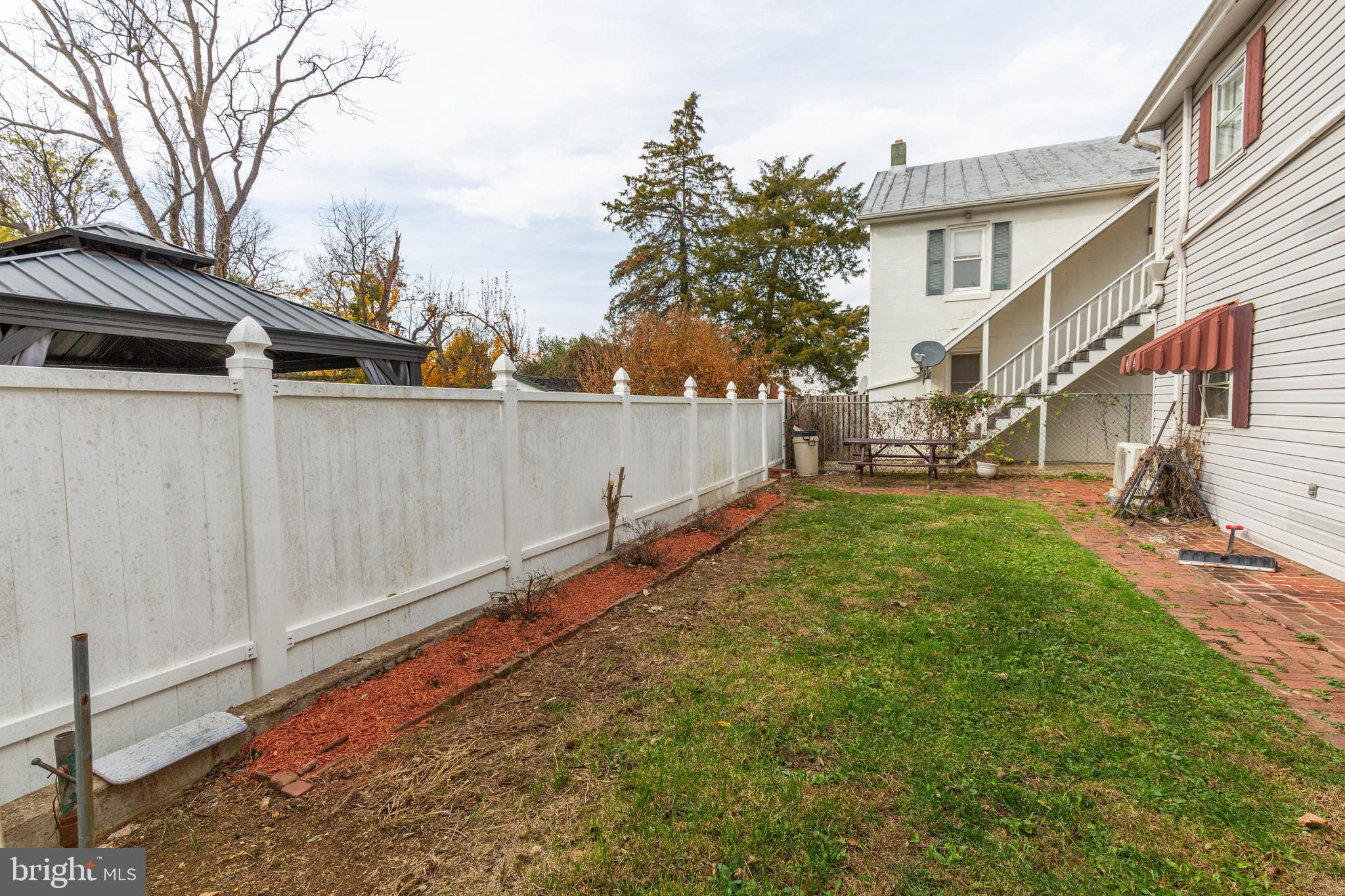 326 East Liberty Street, Unit 6 Charles Town, WV 25414 - Photo 4 of 17 a view of a backyard with a fence
