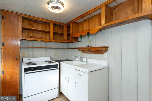 a kitchen with stainless steel appliances granite countertop a sink and cabinets