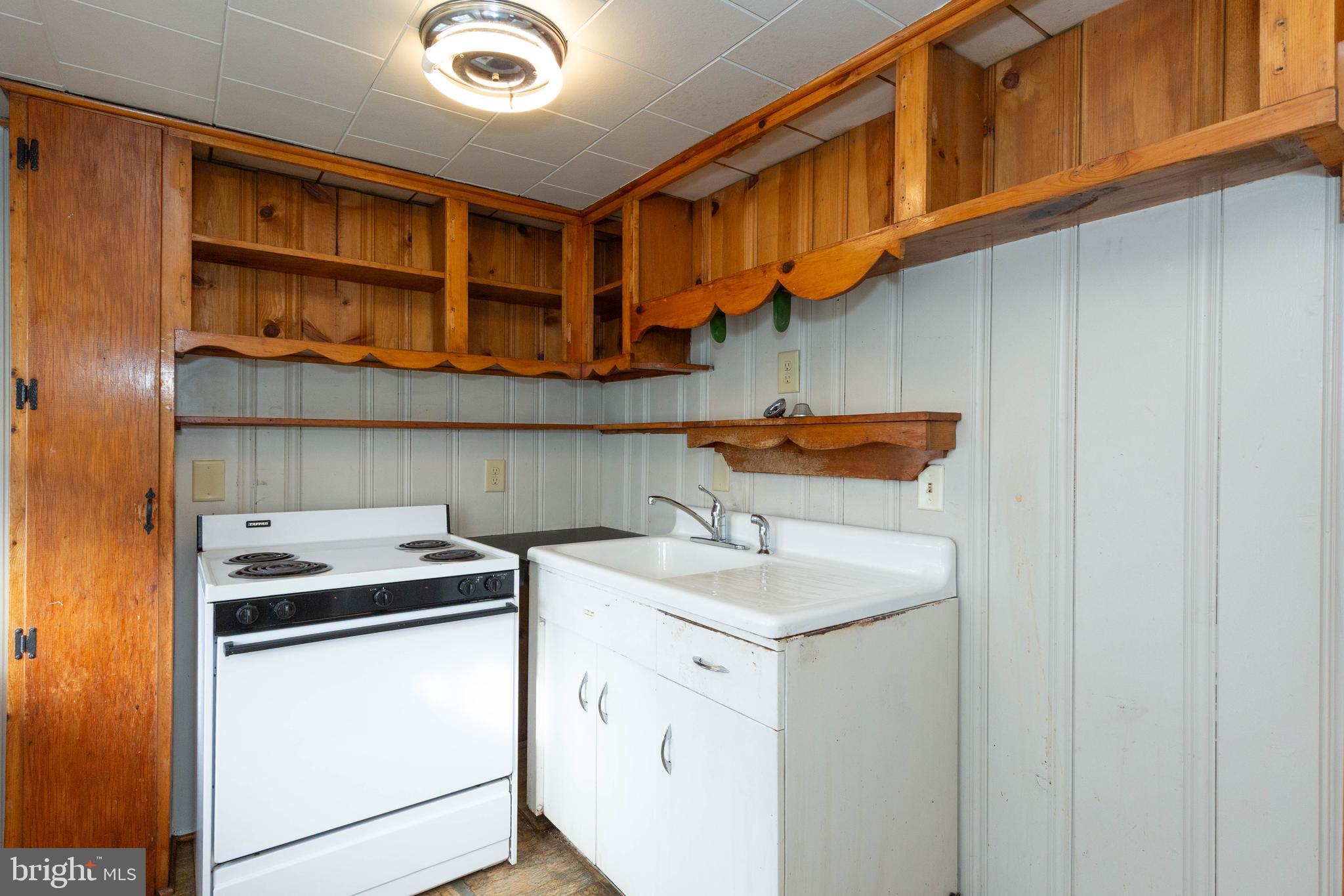 326 East Liberty Street, Unit 6 Charles Town, WV 25414 - Photo 9 of 17 a kitchen with stainless steel appliances granite countertop a sink and cabinets