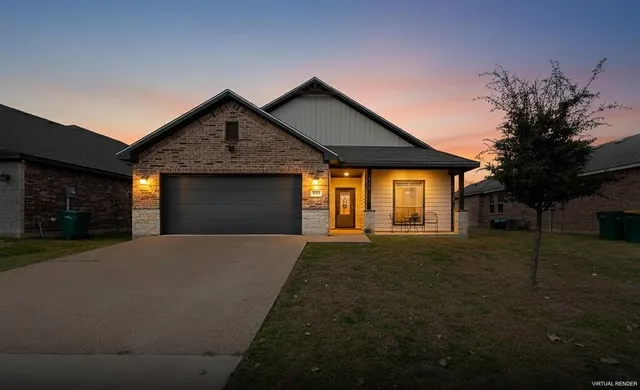 a front view of house with yard and trees