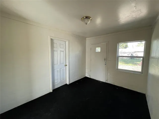 a view of an empty room and window