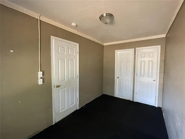 a view of a bedroom from the hallway