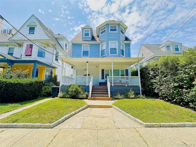 a front view of a building with garden