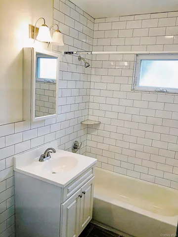 a bathroom with a sink and a bathtub