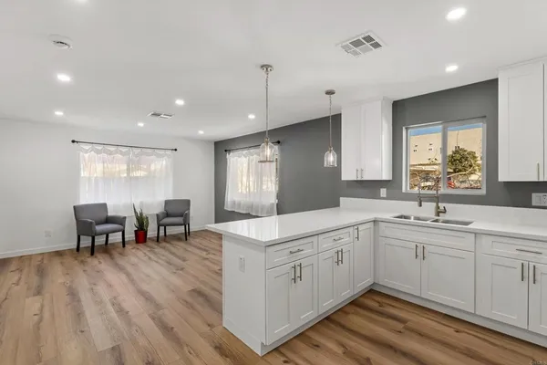 a kitchen with appliances a sink and counter space