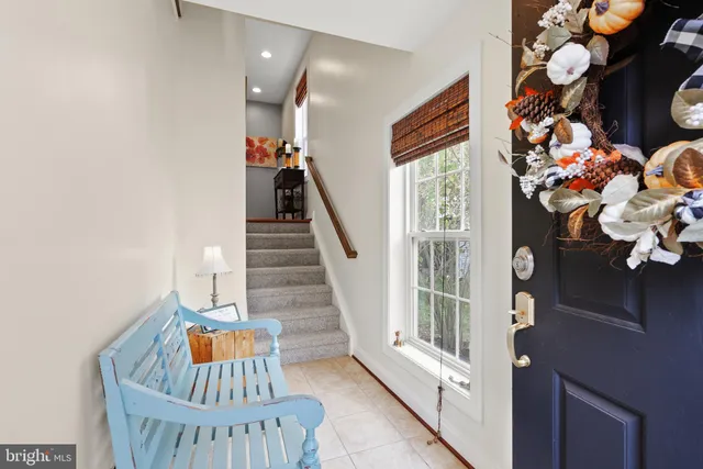 a view of a livingroom with furniture and entryway