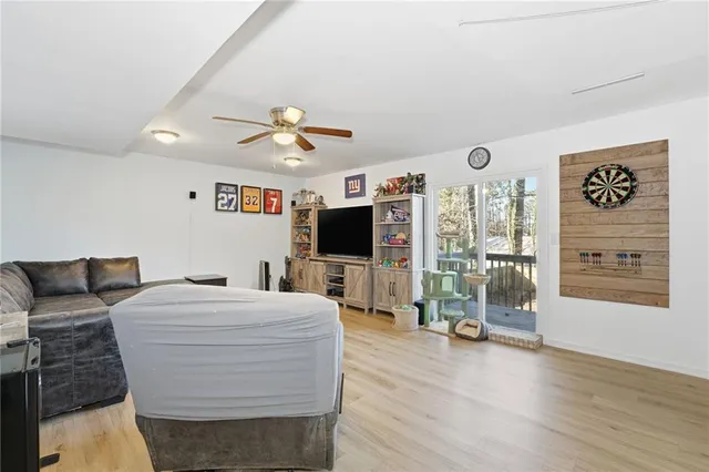a bedroom with a bed couch and window